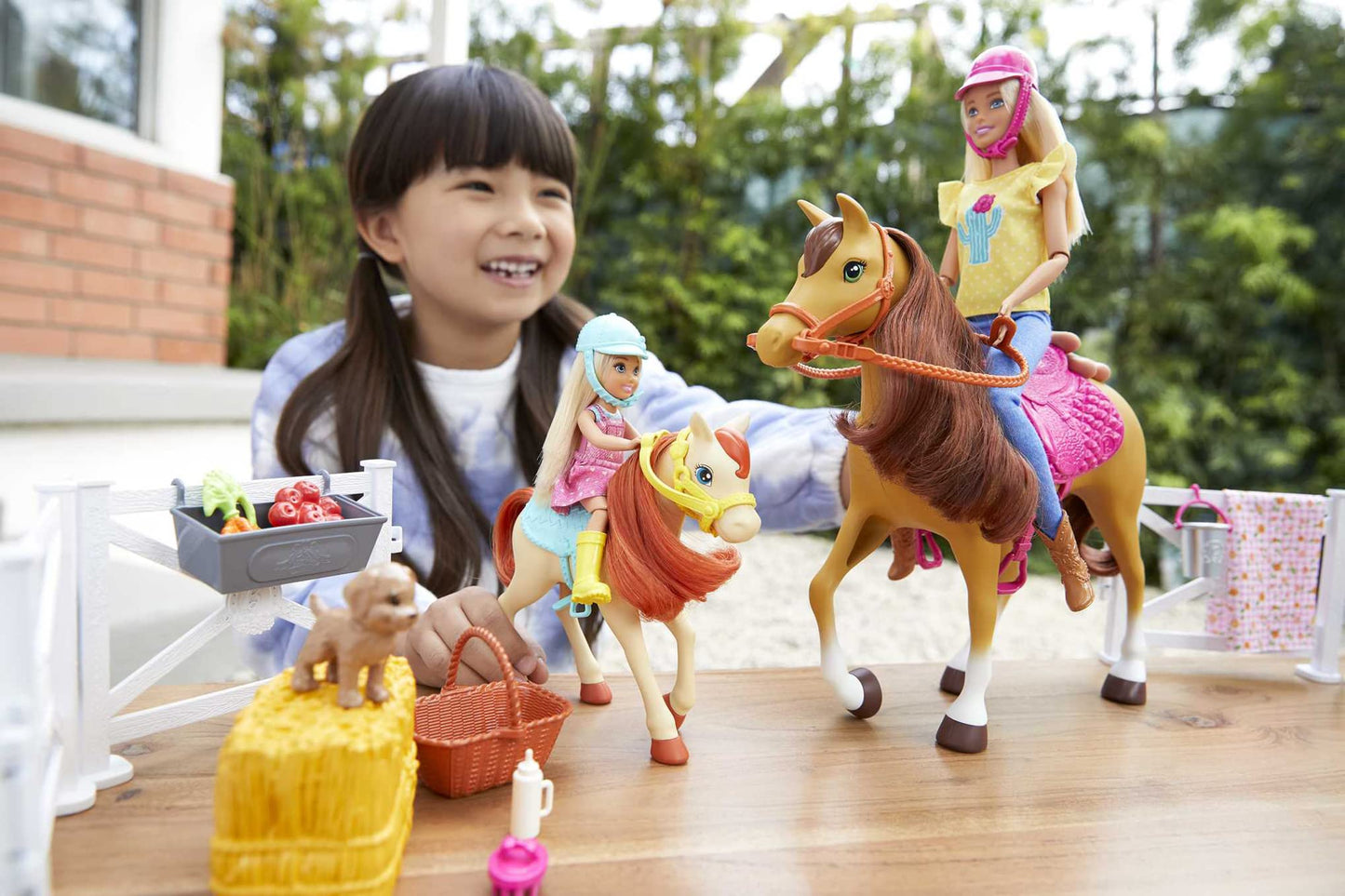 Barbie Playset with Barbie and Chelsea Blonde Dolls, 2 Horses with Bobbling Heads and 15+ Toy Accessories that Include Corral Fencing, Feeding, Grooming, Nurturing and Horseback Riding Pieces for 3Y+