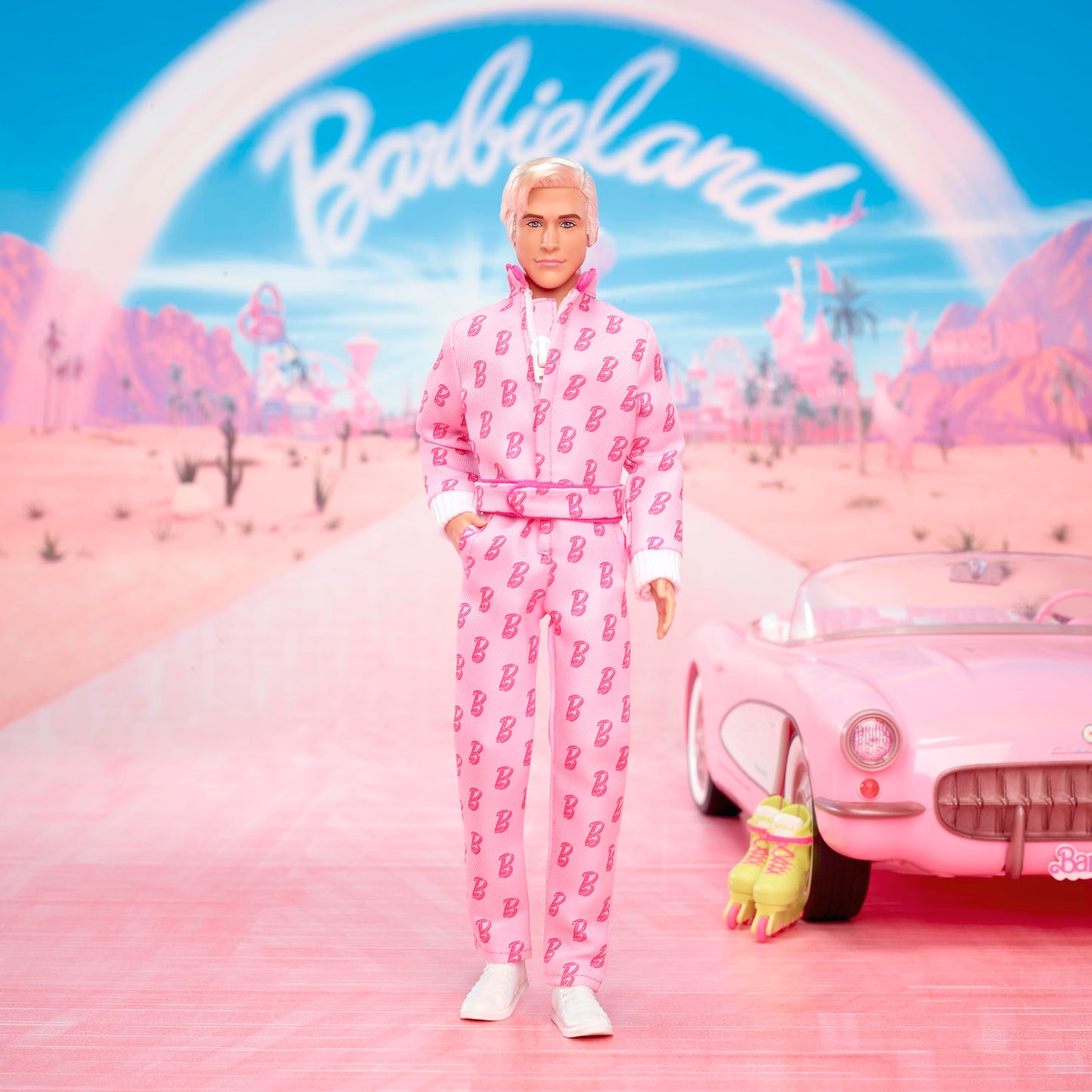 Barbie The Movie Ken Collectible Doll, Ryan Gosling as Ken Wearing Pink Jumpsuit with “B” Detail with White Sneakers and Multicolor Roller Skates