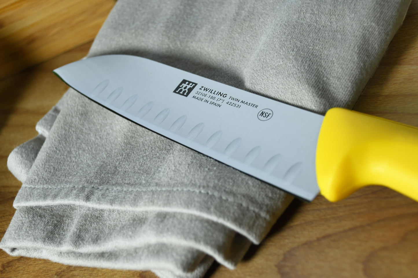 ZWILLING Twin Master 7" Santoku Knife with Granton Edge | 57 Rockwell Hardness | Ergonomic Non-Slip Synthetic Resin Yellow Handles with Enclosed Tang | Made in Spain