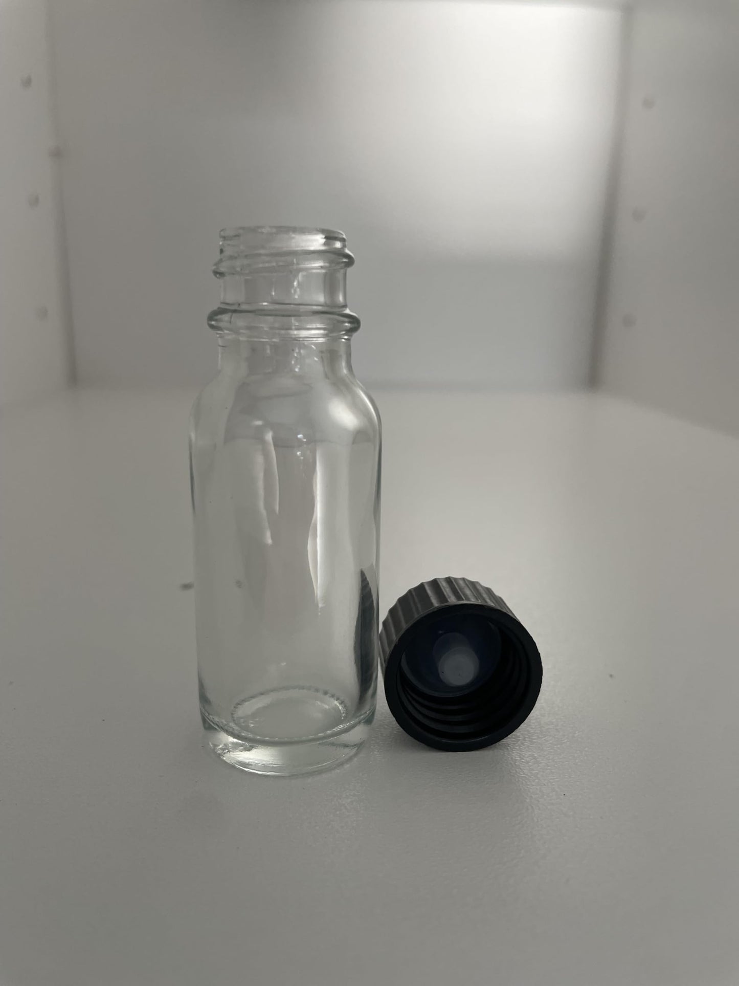 MRS Distributors 1/2 Oz Boston Round Clear Glass Bottle With Black Phenolic Polycone Liner Caps- 144 PACK; Perfect For Perfumes, Essential Oils, Aromatic Blends, Bath and Body, Reagent Liquids 15ml