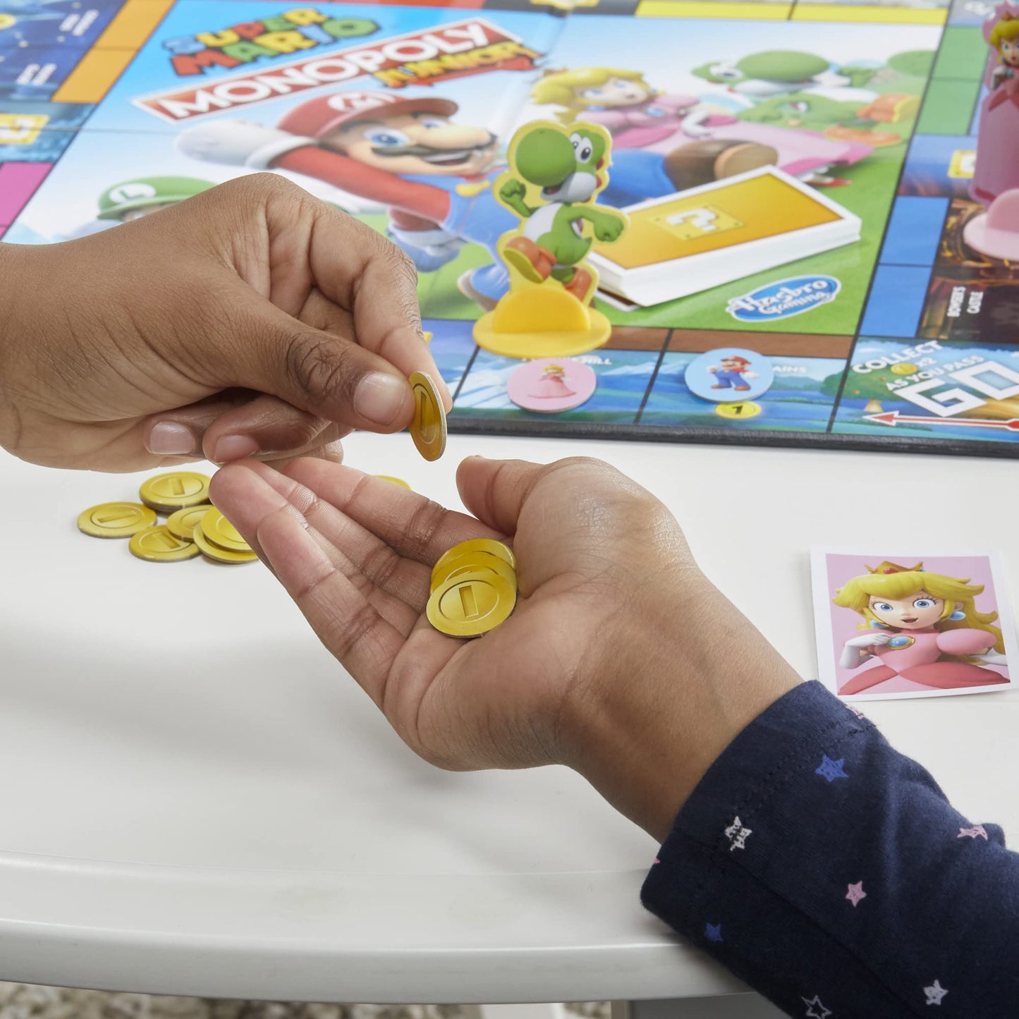 Monopoly Junior Super Mario Edition Board Game, Fun Kids' Game Ages 5 and Up, Explore The Mushroom Kingdom as Mario, Peach, Yoshi, or Luigi - English & French (Amazon Exclusive)
