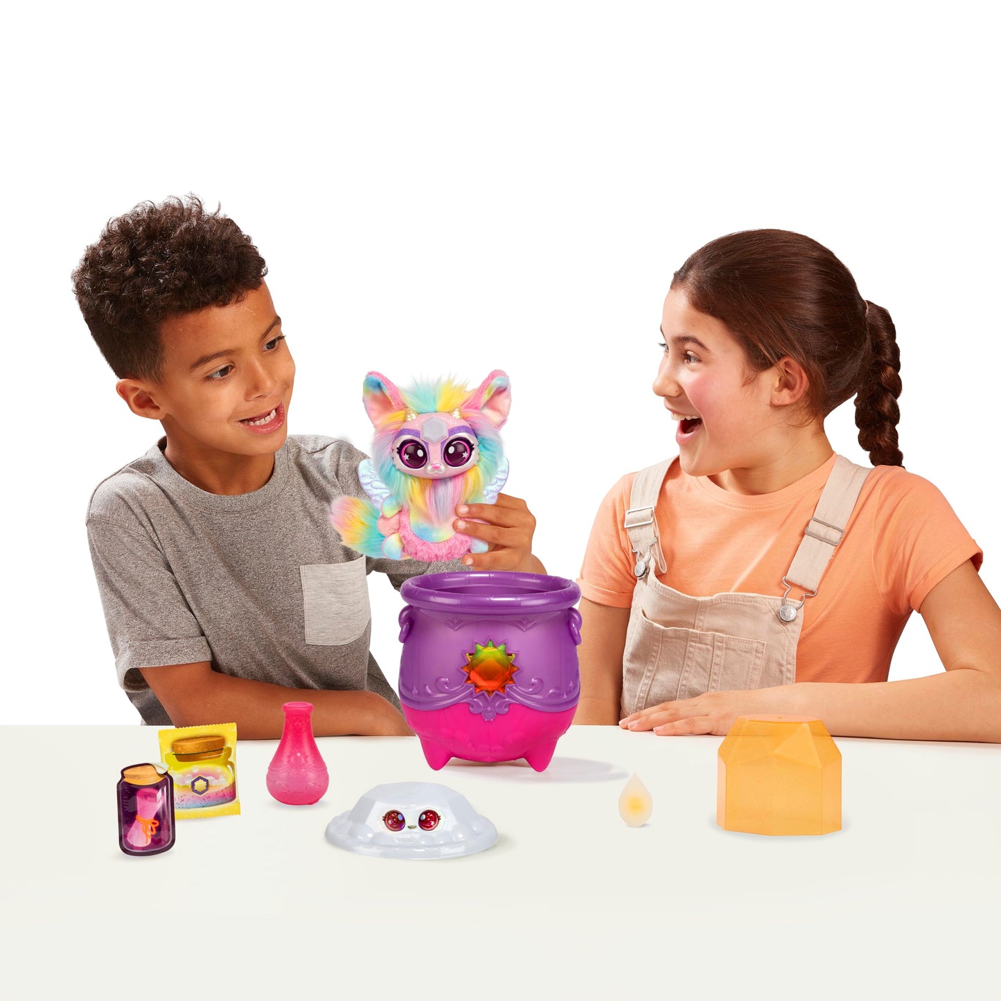 Magic Mixies Magical Gem Surprise Cauldron. with New Shimmer Eyes! Reveal an Mixie Plushie from The Fizzing Cauldron and Discover 2 Magical Solar Gem Surprises!