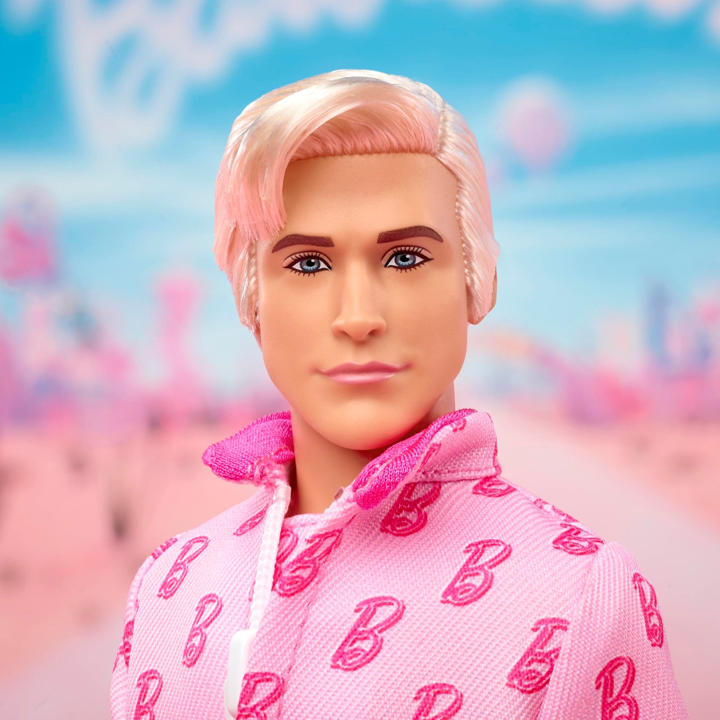 Barbie The Movie Ken Collectible Doll, Ryan Gosling as Ken Wearing Pink Jumpsuit with “B” Detail with White Sneakers and Multicolor Roller Skates