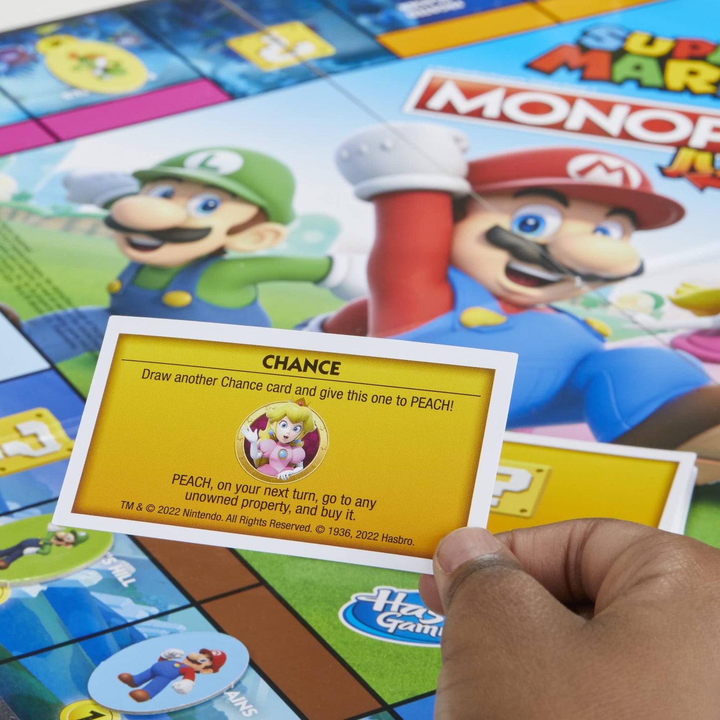 Monopoly Junior Super Mario Edition Board Game, Fun Kids' Game Ages 5 and Up, Explore The Mushroom Kingdom as Mario, Peach, Yoshi, or Luigi - English & French (Amazon Exclusive)