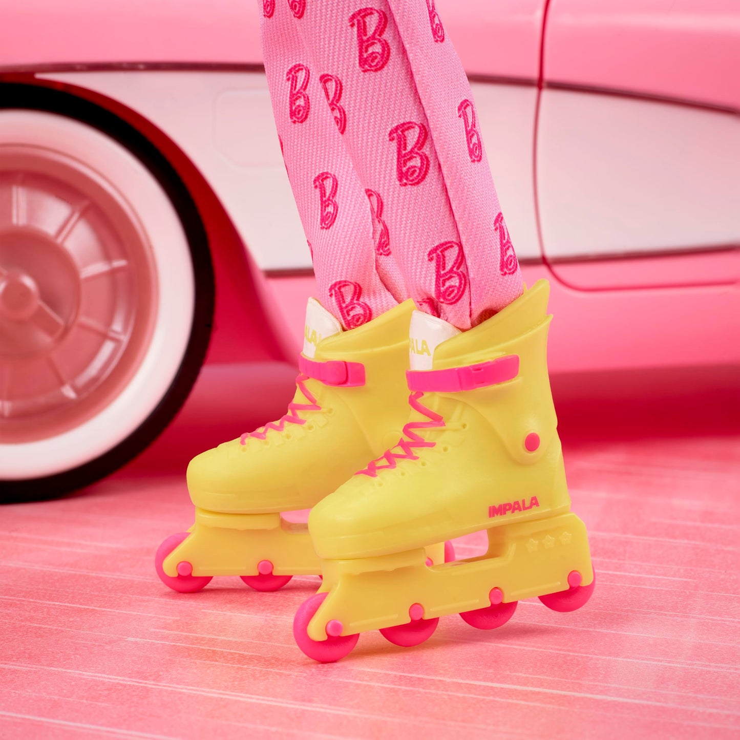 Barbie The Movie Ken Collectible Doll, Ryan Gosling as Ken Wearing Pink Jumpsuit with “B” Detail with White Sneakers and Multicolor Roller Skates